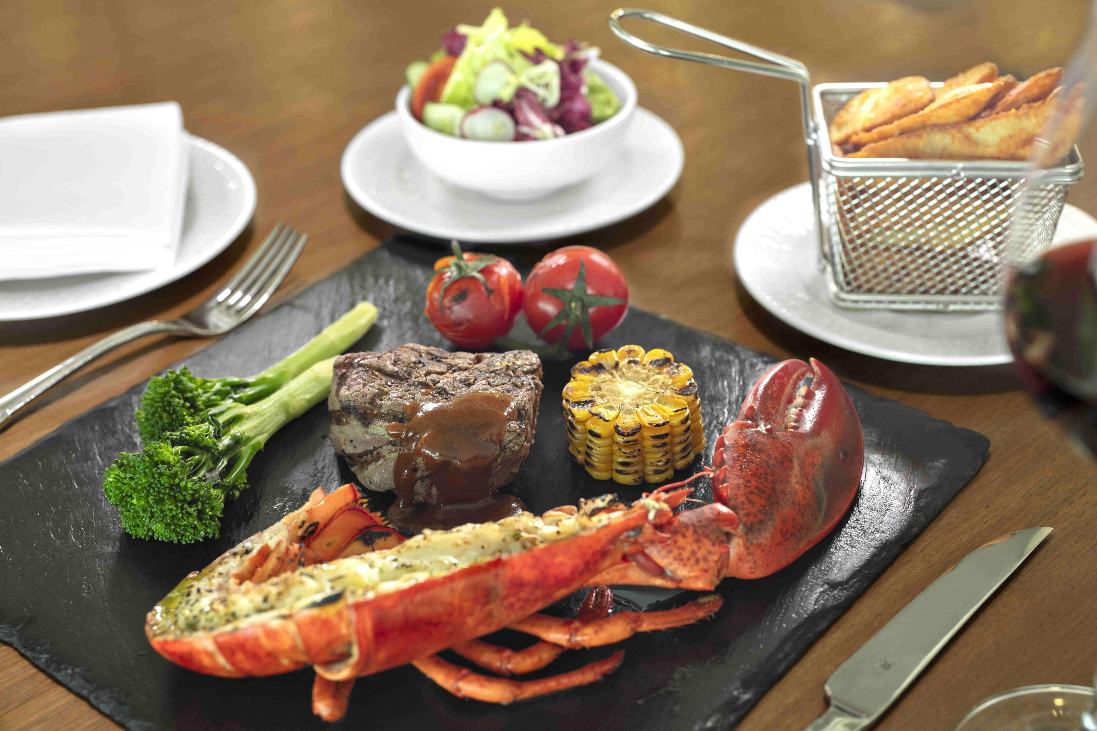 Radisson Blu Hotel Shanghai New World Exterior photo A surf and turf meal