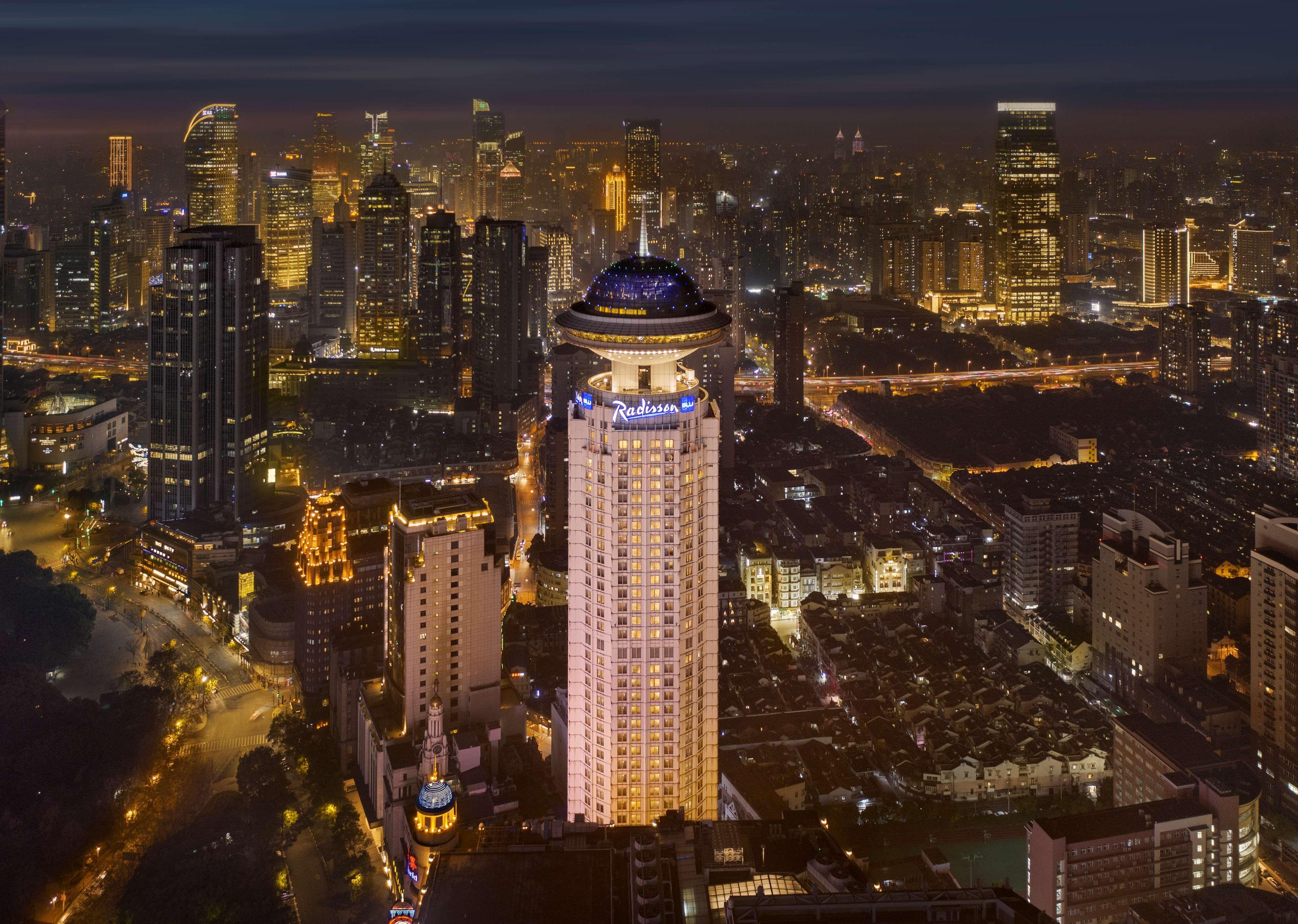 Radisson Blu Hotel Shanghai New World Exterior photo The Four Seasons Hotel, one of the first LEED Platinum certified hotels in the world